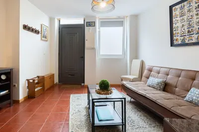 a living room with a couch and a table at Host Wise - Stylish Adorable Flat in Gaia in Vila Nova de Gaia