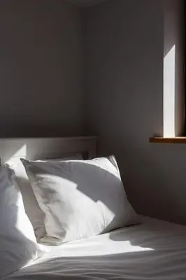 a bedroom with a bed with white sheets and a window at Chic Loft with Garden, Sleeps 4 in Porto