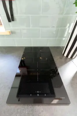 a laptop computer sitting on top of a counter at Chic Loft with Garden, Sleeps 4 in Porto