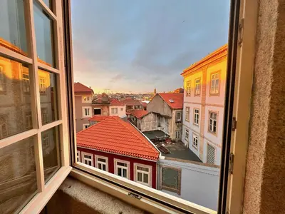 a view of a city from an open window at Downtown Premiu in center of Porto 3BR with AC in Porto