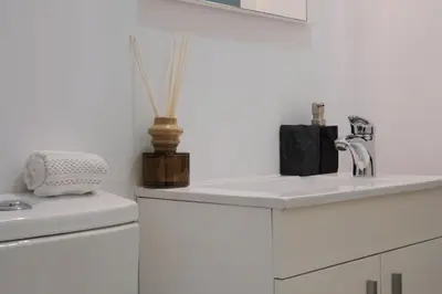 a white kitchen with a sink and a toilet at Downtown Premiu in center of Porto 3BR with AC in Porto