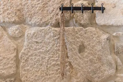 a bunch of rope hanging from a rock at GuestReady - Industrial stay in downtown Porto in Porto