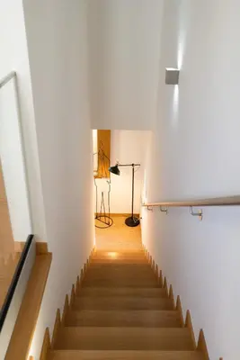 a staircase in a building with a light at the top at Host Wise - Elegant Home in the Heart of Porto in Porto