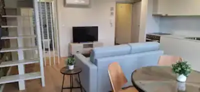a living room with a couch and a table at Fontainhas Douro Flats in Porto