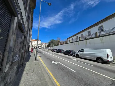 a white van parked on the side of a street at Fontainhas Douro Flats in Porto