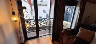 a room with a view of a balcony at Vila Terra Studio III in Vila Nova de Gaia