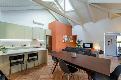 a living room with a couch and a table at Spritz Hour House in Porto