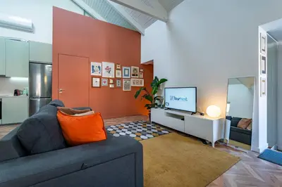 a kitchen with white cabinets and a sink at Spritz Hour House in Porto