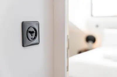 a door knob with a person in the background at Sao Lazaro Premium Apartments in Porto