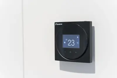 a digital alarm clock on a white wall at Sao Lazaro Premium Apartments in Porto