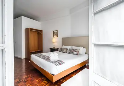 a bedroom with a bed and a window at Office Suits in Flores by D&S in Porto