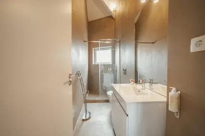 a bathroom with a white sink and a toilet at Downtown Elegant by Hosty in Porto