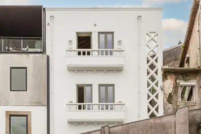 a white building with a balcony on the side of it at Douro's Balcony View - Swimming pool in Vila Nova de Gaia
