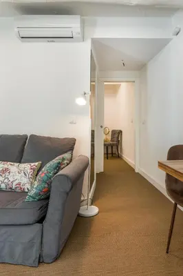 a living room with a couch and a table at By the River 1 by Porto Dream Stays in Porto