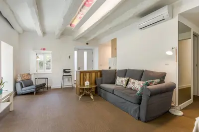 a living room with a couch and a table at By the River 1 by Porto Dream Stays in Porto