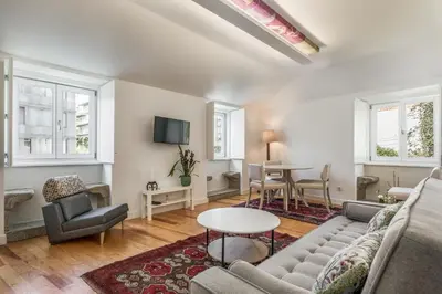 a living room with a couch and a table at By the River 2 by Porto Dream Stays in Porto