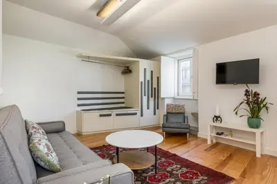 a living room with a couch and a table at By the River 2 by Porto Dream Stays in Porto