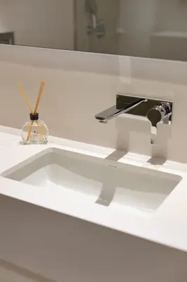 a white bathroom with two sinks and a mirror at Formosa City Studio in Porto
