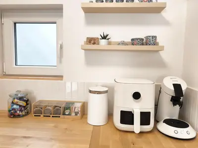 a kitchen with two coffee machines on a counter at Casa Moara - Downtown Duplex House in Porto