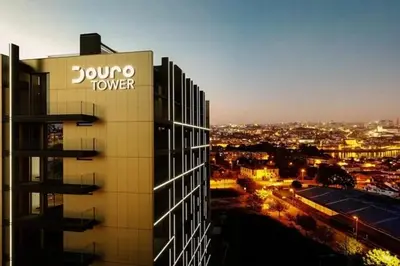 a building with a sign on the side of it at New Douro 406 with parking in Vila Nova de Gaia