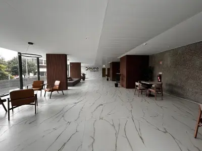 a lobby with a marble floor and tables and chairs at New Douro 406 with parking in Vila Nova de Gaia