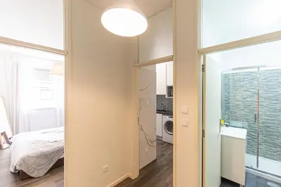 a small bedroom with a bed and a window at Now Trindade in Porto