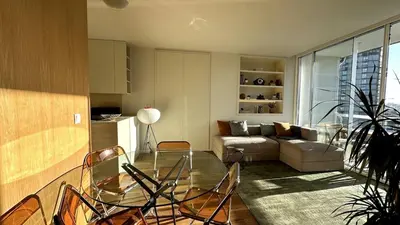 a living room with a glass table and chairs at BEST - Apartment with AC, Parking and Balcony in Porto