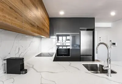 a kitchen with a sink and a stove top oven at Feel Porto Lapa Collection Flats in Porto