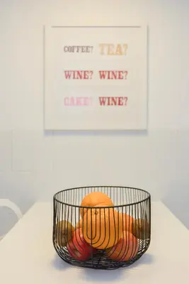 a basket of fruit on a table with a picture at Local 167 - Oporto View House in Vila Nova de Gaia