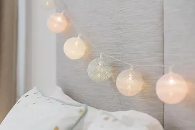 a group of glass ornaments hanging on a wall at GuestReady - Fabric Porto Apartment in Porto