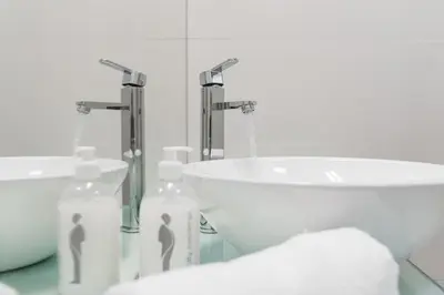 a bathroom with a sink and a tub and a sink at GuestReady - Fabric Porto Apartment in Porto