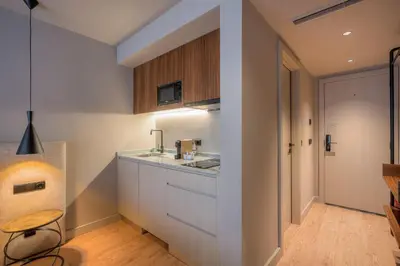 a kitchen with white cabinets and a sink at Carpe Diem Porto By Dualgroup in Porto