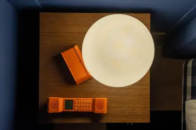a table with a plate and a remote control at Hotel Kodawari Flores - by Kodawari Residences in Porto