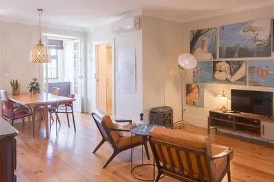 a living room with a table and a dining room at Once Upon in Porto Apartment III in Porto