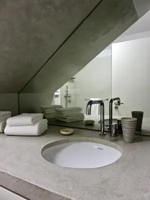 a bathroom counter with a sink and a mirror at Oporto Serviced Apartments - Miragaia II in Porto
