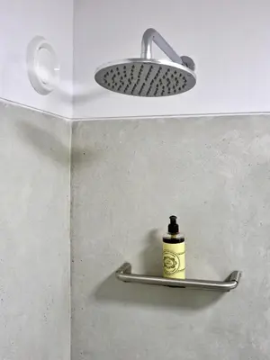 a bathroom with a light and a bottle on a shelf at Oporto Serviced Apartments - Miragaia II in Porto