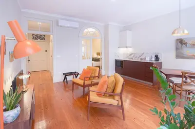 a living room with a dining room and a kitchen at Once Upon in Porto Apartments I in Porto