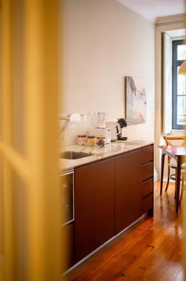 a kitchen with a sink and a counter at Once Upon in Porto Apartments I in Porto