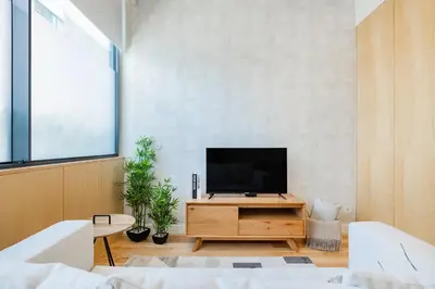 a bedroom with a large white bed with pillows at Casa da Música Modern Flat in Porto