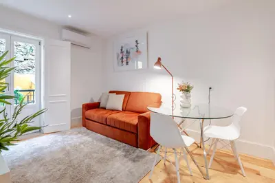 a kitchen with a sink and a counter top at Almada Prime Apartment I in Porto
