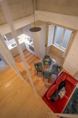 an overhead view of a living room with a table and chairs at Andrade Rooftop Duplex in Porto
