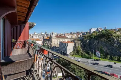 a balcony of a building with a view of a city at Catedral da Sé Apartment in Porto