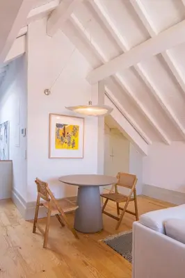 a dining room with a table and chairs at Rua Formosa 99 in Porto
