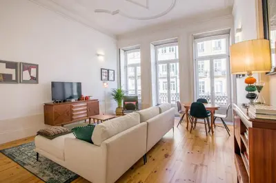 a living room with a couch and a table at Mouzinho Hill View in Porto