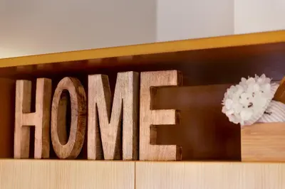 a wooden sign that says homearma on a shelf at VIVA Cozy Downtown in Porto