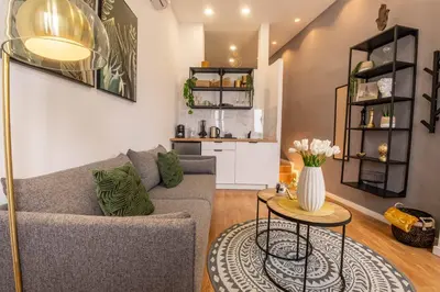 a living room with a couch and a table at River Corticeira II in Porto