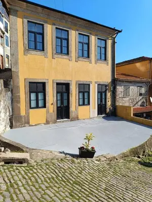 a house with a large driveway in front of it at River Corticeira II in Porto