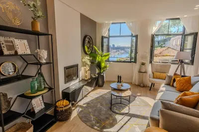 a living room with a couch and a table at River Sight Corticeira III in Porto