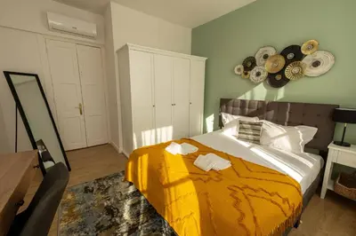a bedroom with a bed with a yellow blanket at River Sight Corticeira III in Porto