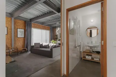 a living room with a couch and a sink at Loveporto Varanda Jardim Centro in Porto